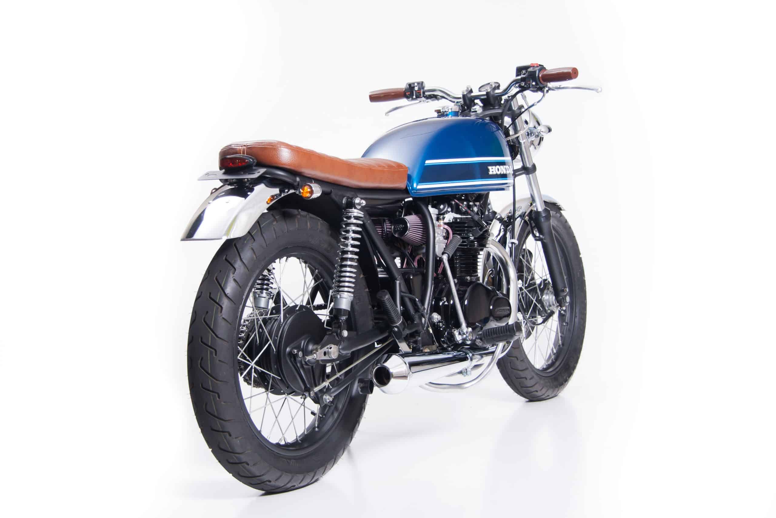 Custom exhaust, seat, fenders, controls and much more compliment the tank from a CB500T